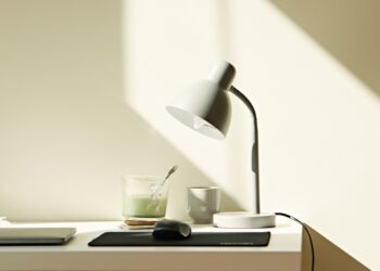 At home work desk with Matcha Tea, Mouse, Laptop and Lamp.