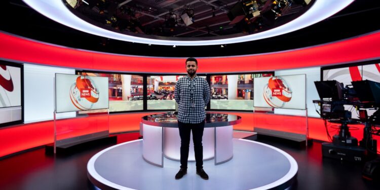 Male broadcast engineer in studio
