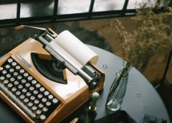 Vintage typewriter for typing. Styled desk with dried flowers & a wax seal stamp.