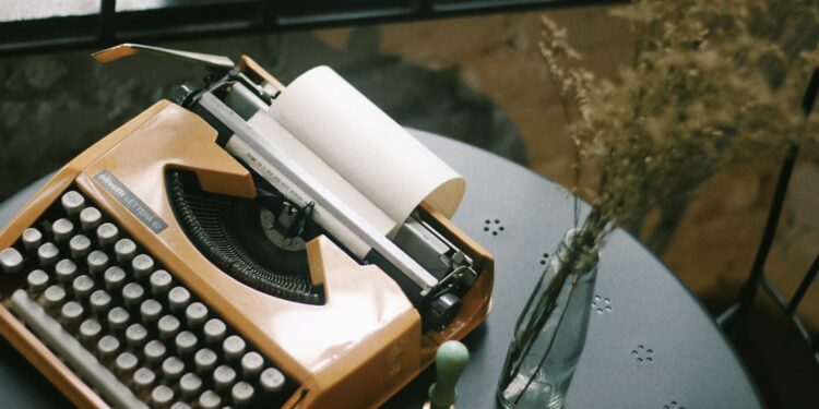 Vintage typewriter for typing. Styled desk with dried flowers & a wax seal stamp.