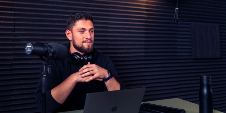 Podcast host waiting for answer