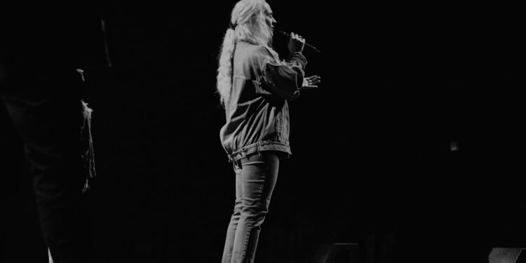 female singers on stage worshipping Jesus